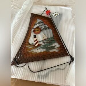 Metal wall art w/lighthouse sailboat nwt beautiful colors